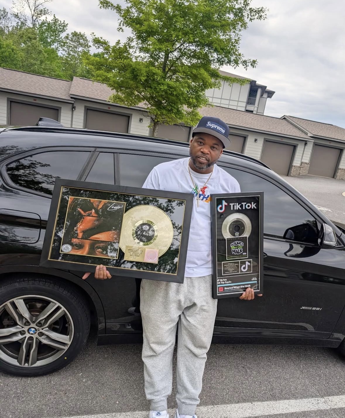 Artist with RIAA Gold and TikTok plaques